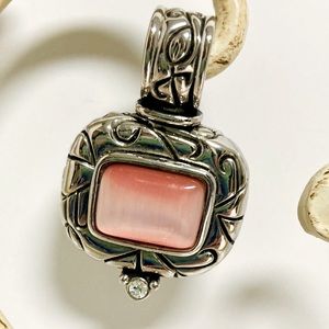 Beautifully designed silver pendant with pink stone and fashion diamond.
